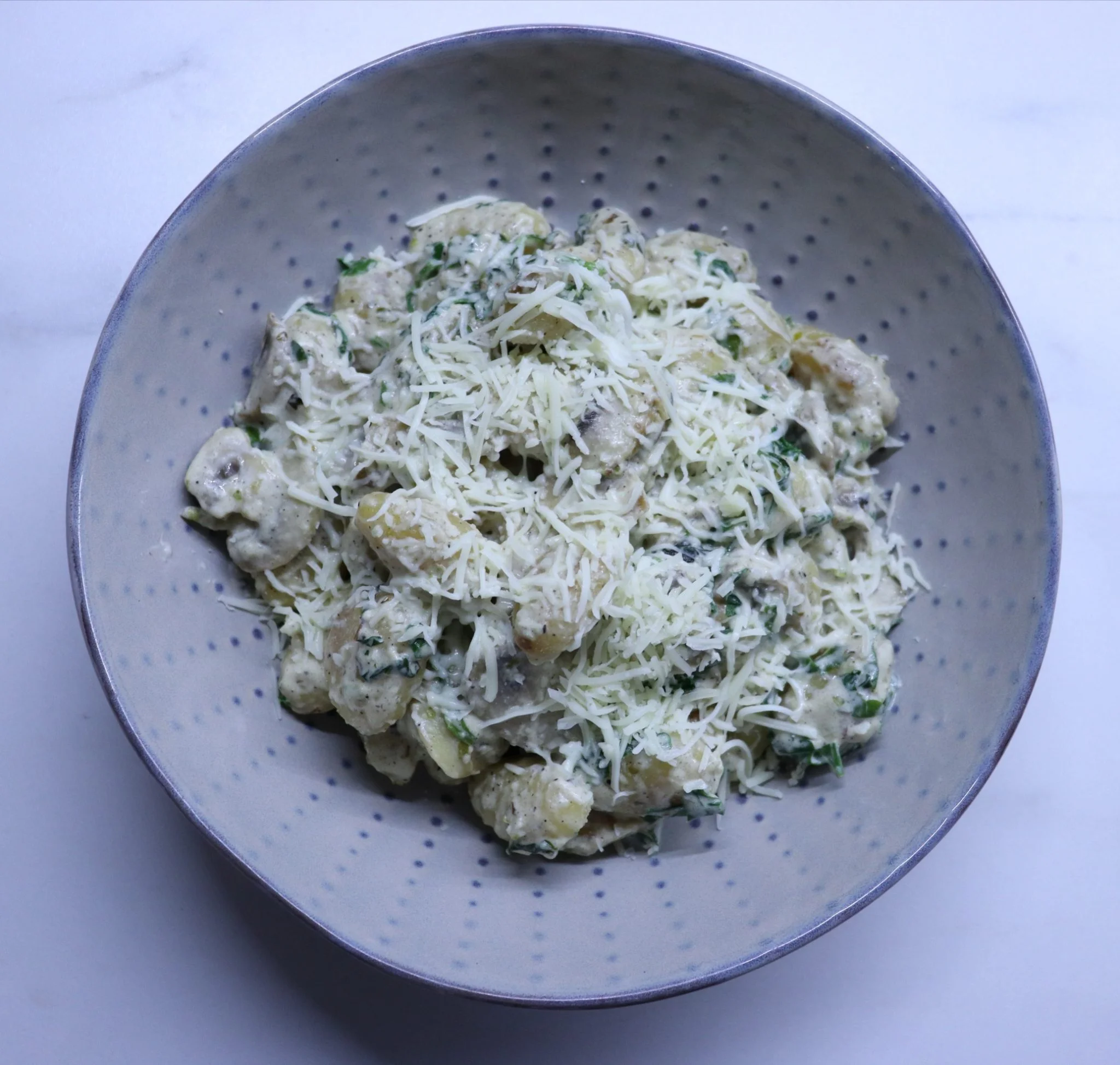 Gnocchi with mushroom and spinach sauce